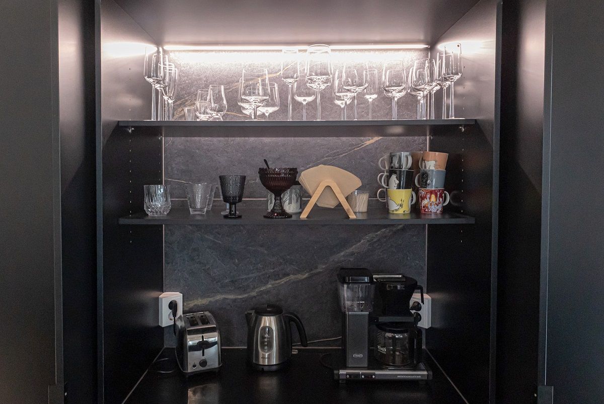 Breakfast cabinet with led ribbon on the back of the top shelf.