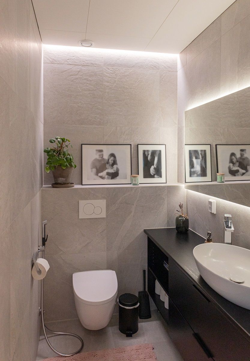 LED strip in the recess between wall and ceiling and behind the mirror.