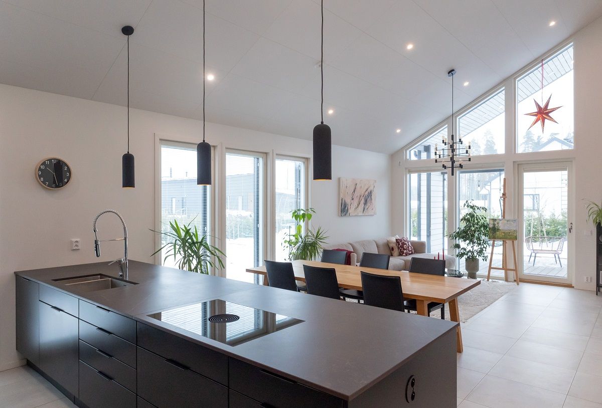 Several led spotlights on the ceiling of the living room, plus the client's own pendant lights.