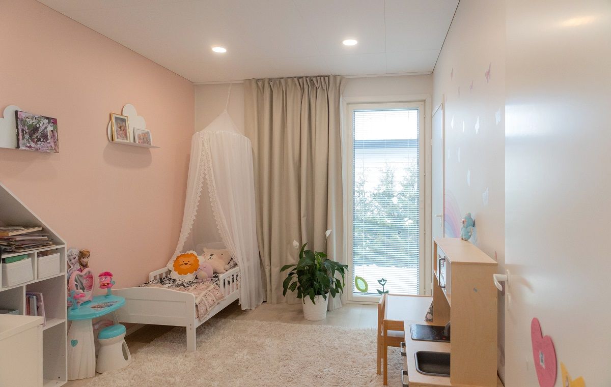 Small round led panels flush mounted in a children's room.