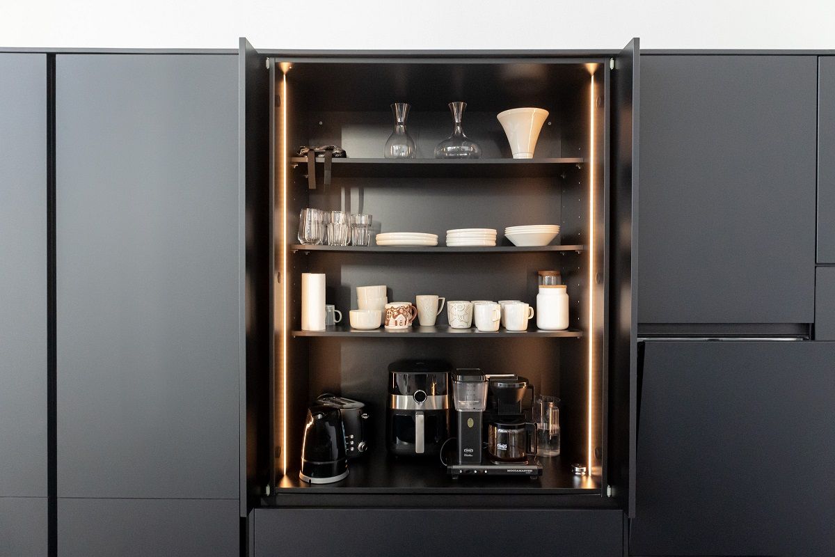 LED strip mounted vertically on both sides of a breakfast cabinet