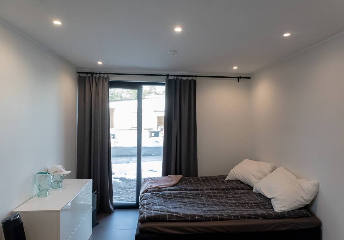 Round R023 LED downlights on the bedroom ceiling.