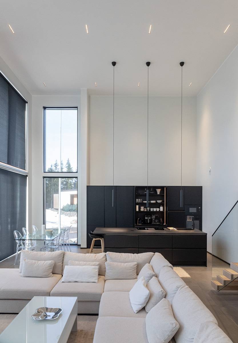 LINJA light fixtures on the ceiling of a high-ceilinged space.