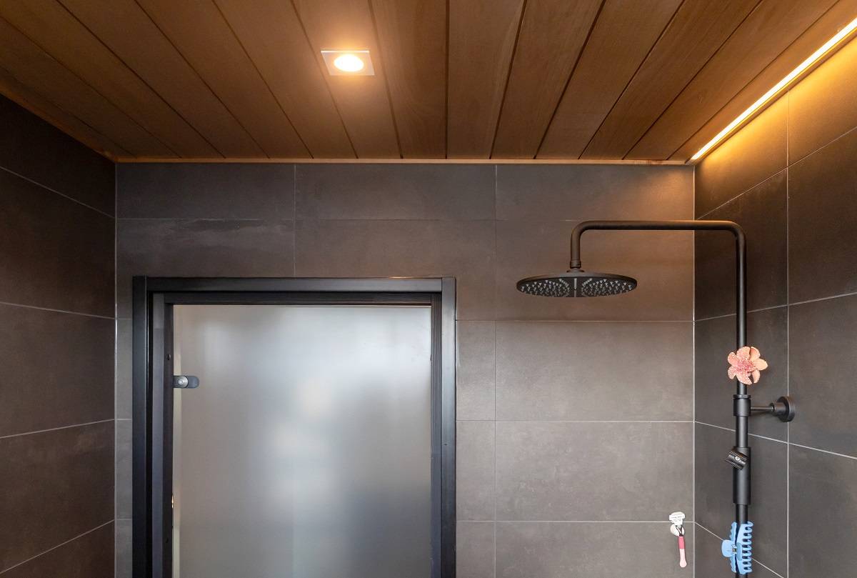 Bathroom illuminated with led strip and spotlight