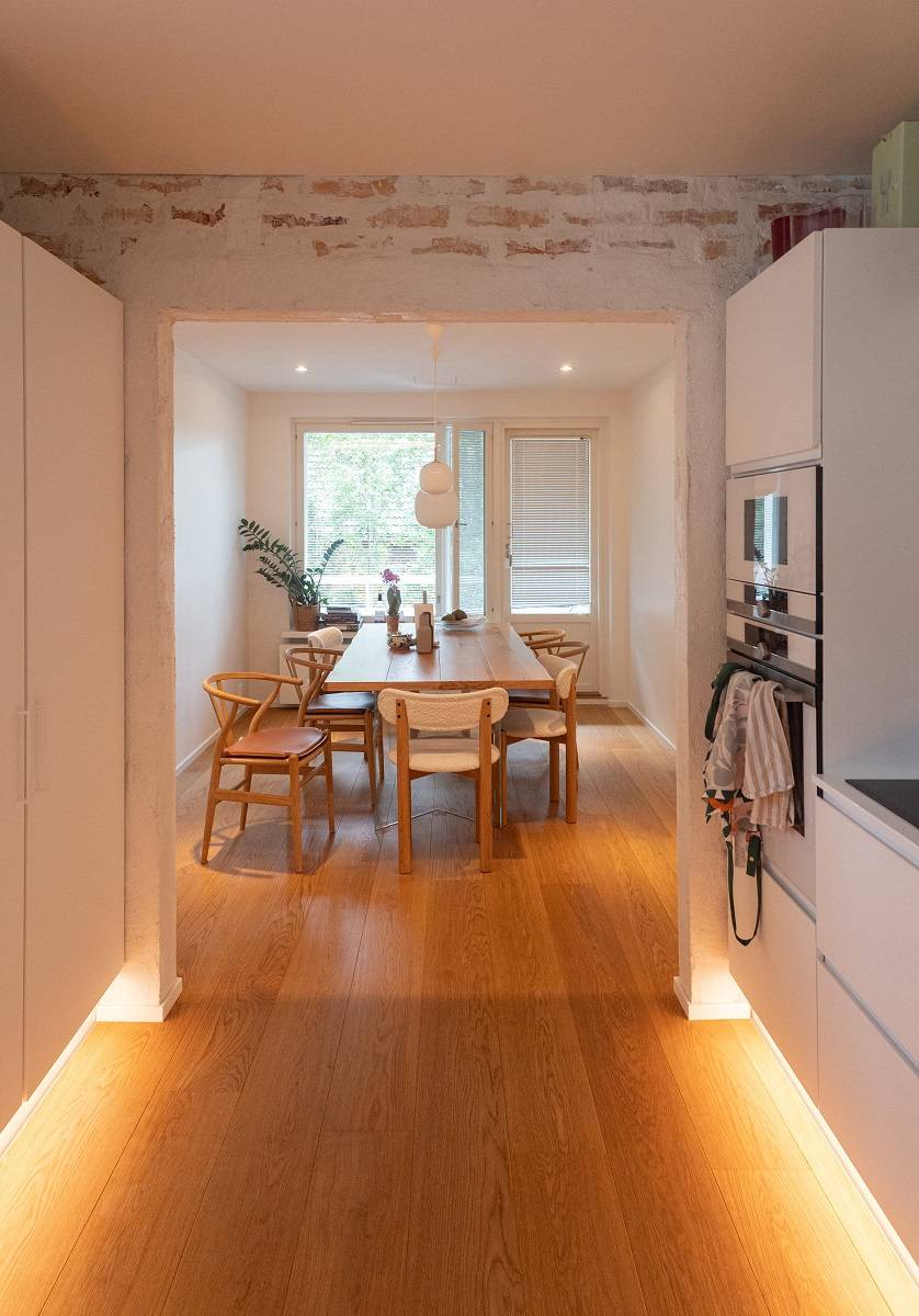 LED strip lighting on both sides of the baseboard in the kitchen.