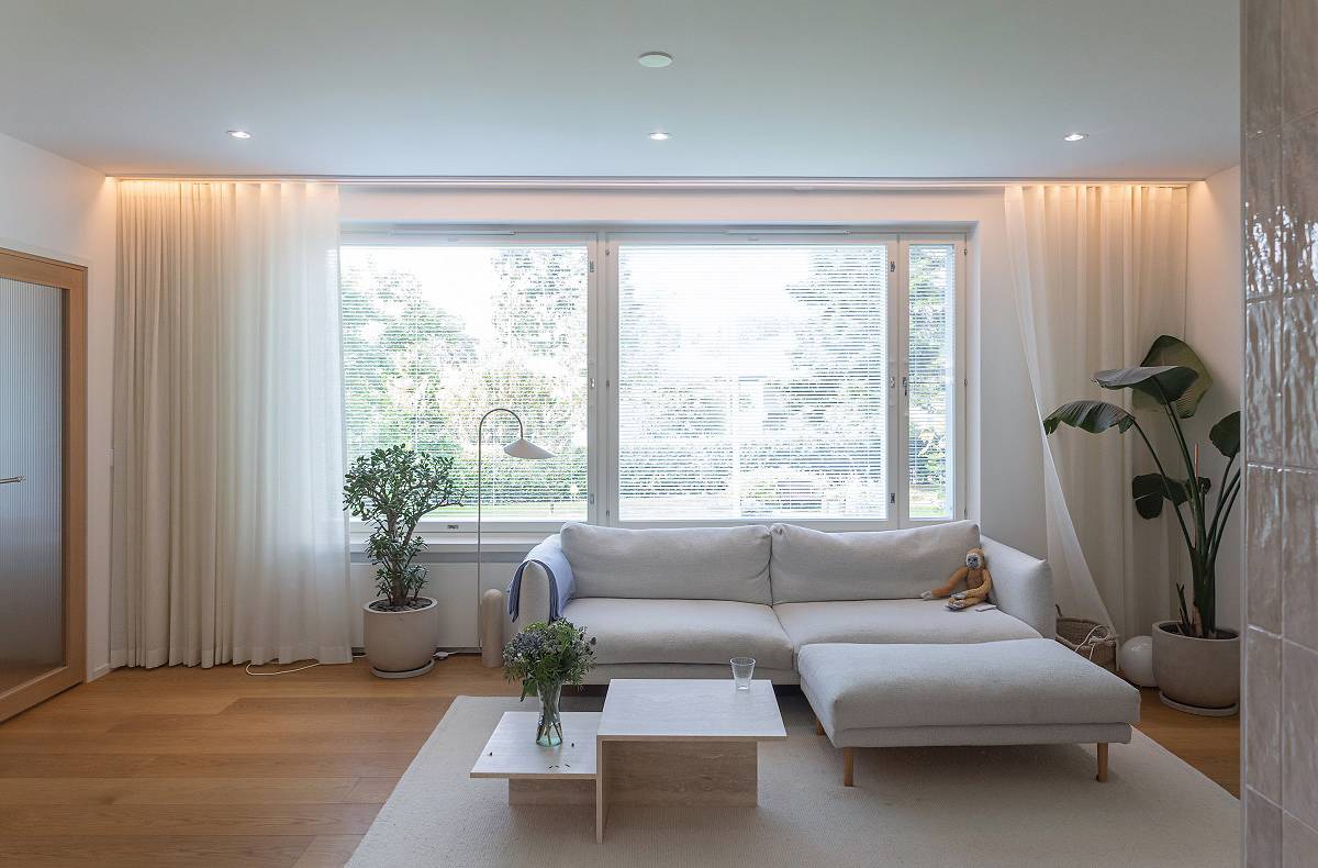 LED strip behind the living room curtain rod and spotlights on the ceiling.