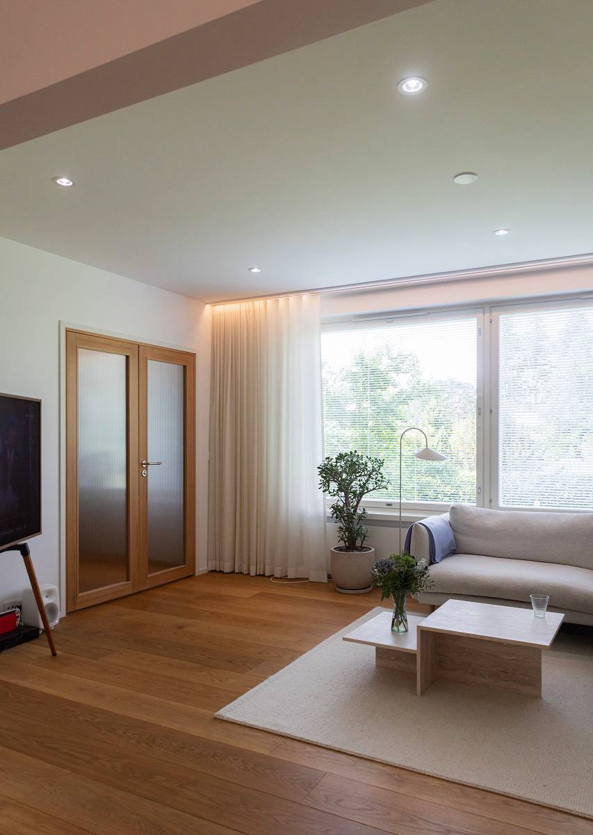The downlights are arranged symmetrically throughout the room to provide general lighting.
