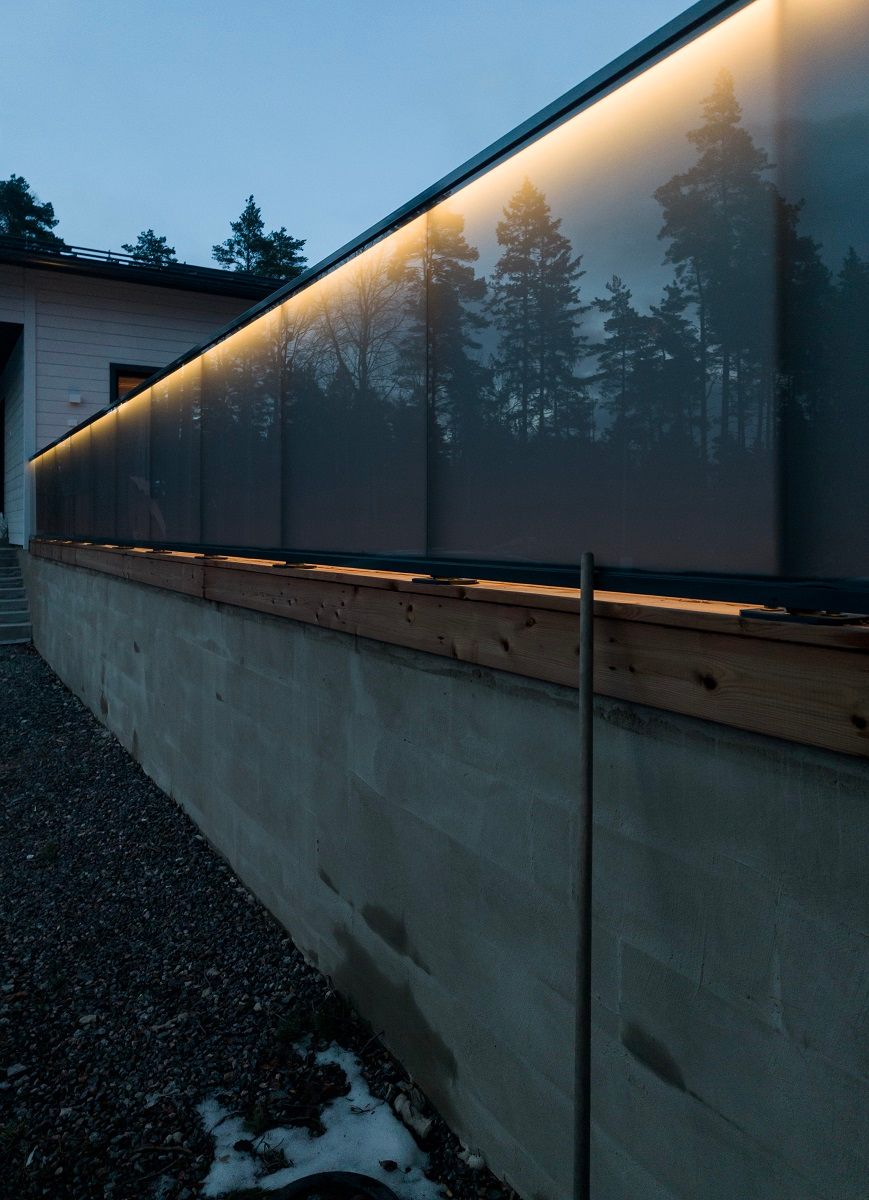 LED strip light on a glass railing outside.