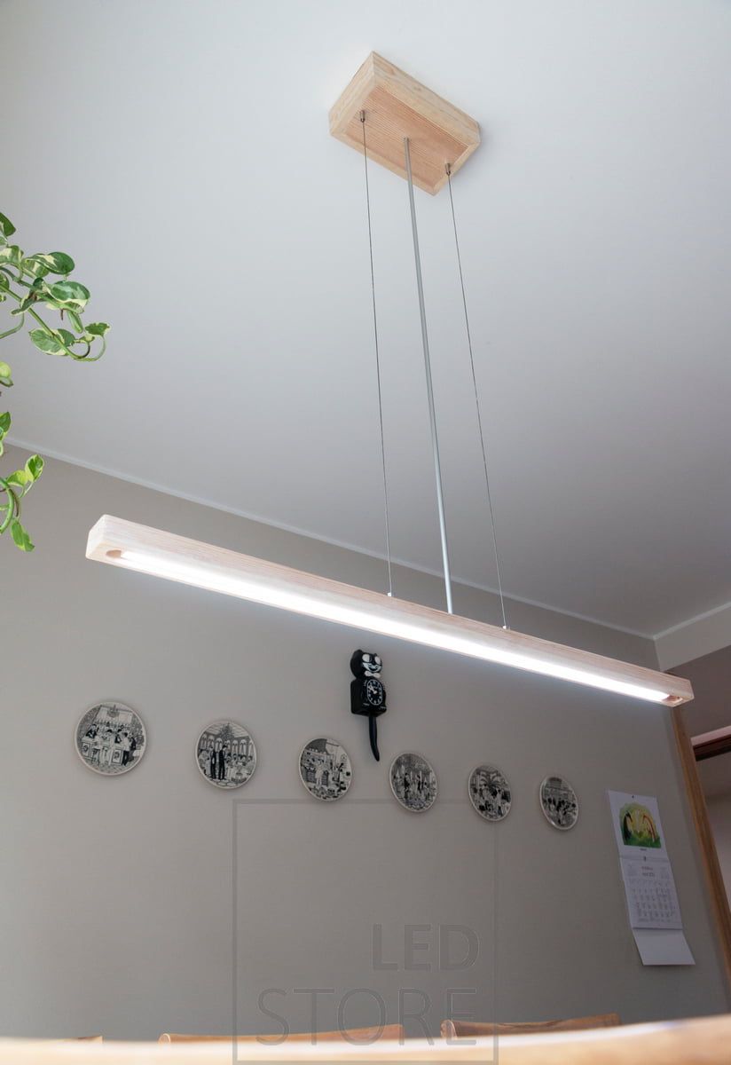 Customer-built kitchen luminaire with CCT LED strip and aluminium profile embedded in a wooden frame. Wireless control power supply in the ceiling cup. LedStore.fi