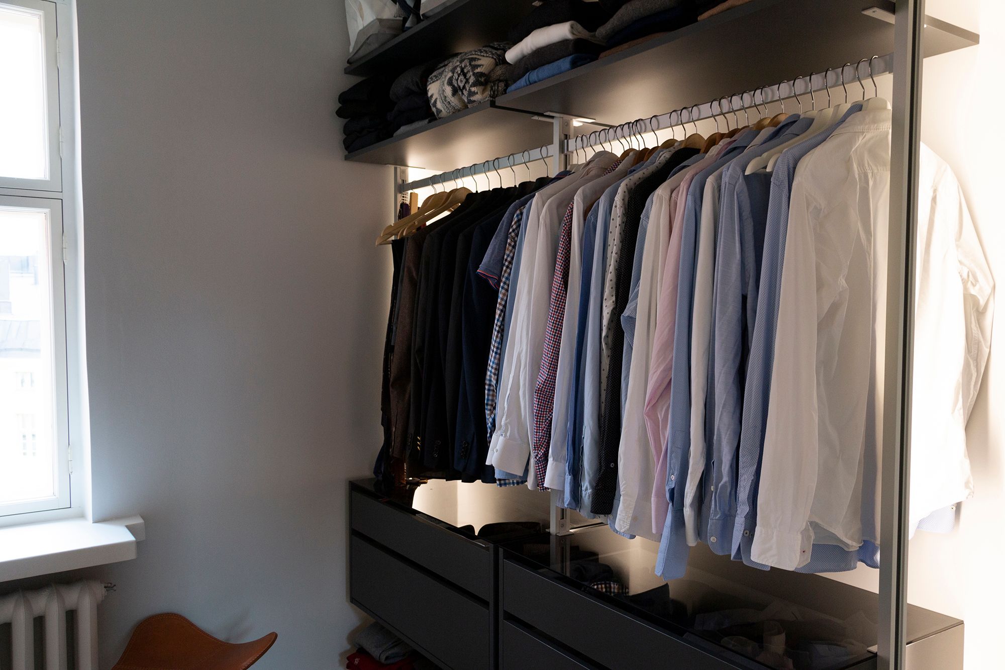 Led strips illuminating clothes and wardrobe with indirect light. Ledstore.fi