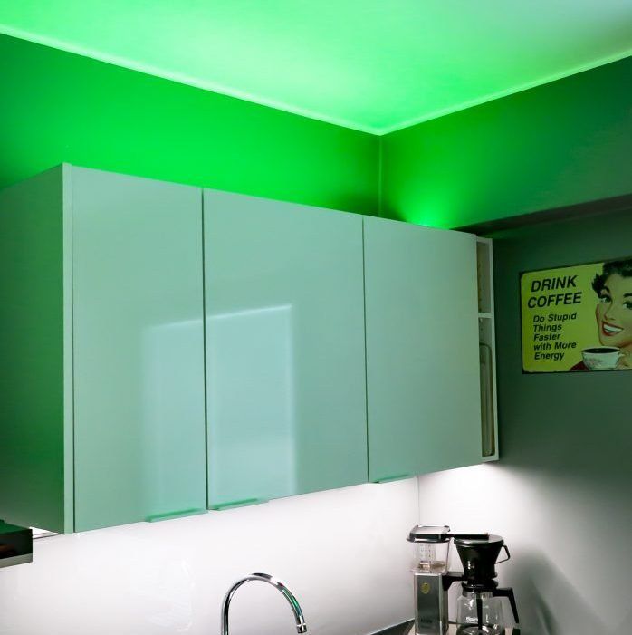 Lighting design can change the look of a space. Here, an RGBW LED strip on top of a cabinet in an aluminium profile.