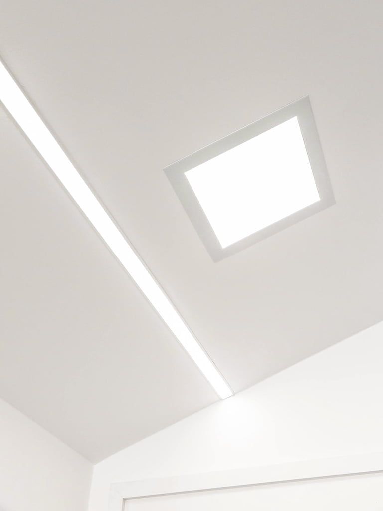 Green background with a white square in the middle with "LED STORE" in vertical white letters - LED lighting store brand.