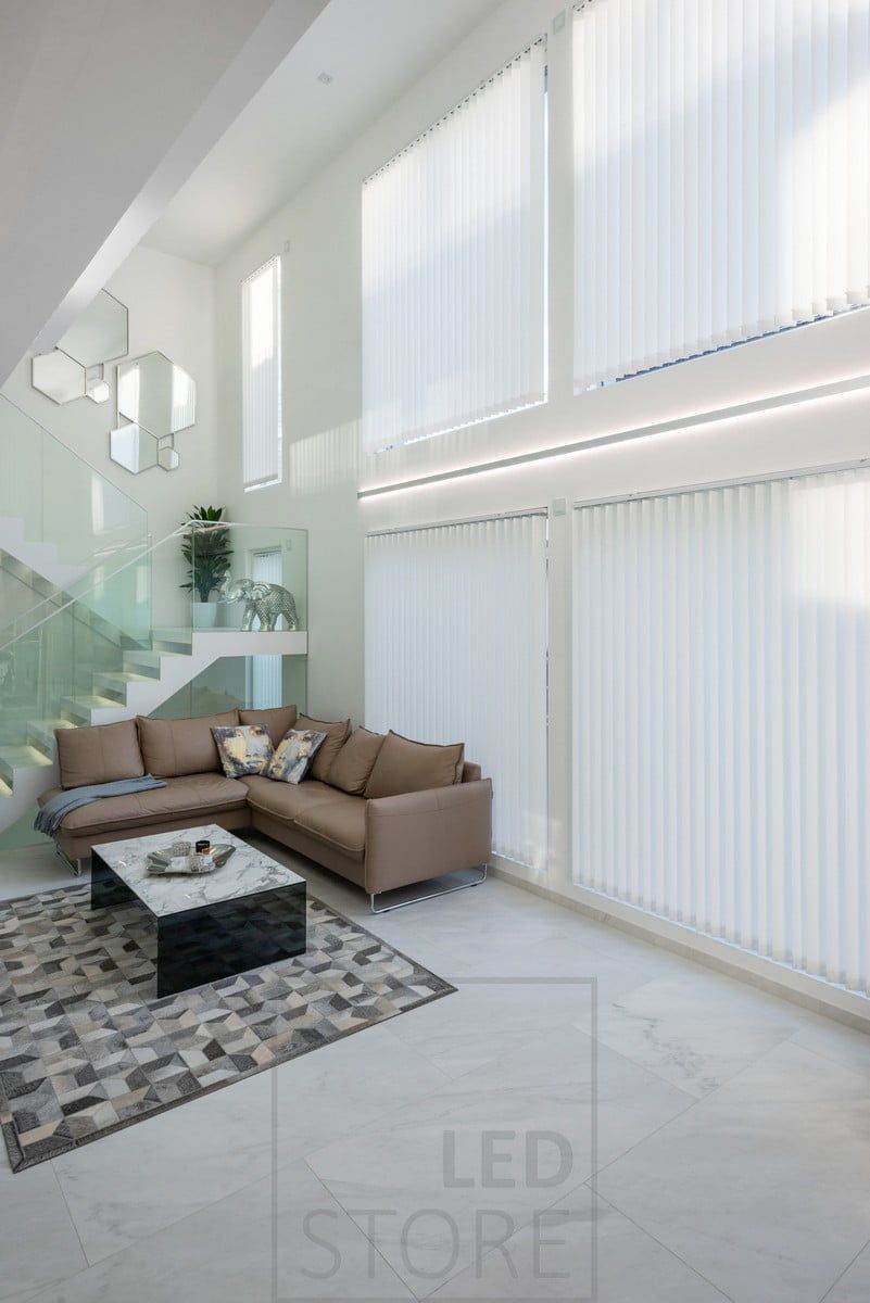 The height of the living room and the windows are accentuated by LED strips in a bi-directional profile. Profile and LED strips available made to measure, one complete profile is 2,5 m long. The bi-directional profile is also available in black. Ledstore.fi