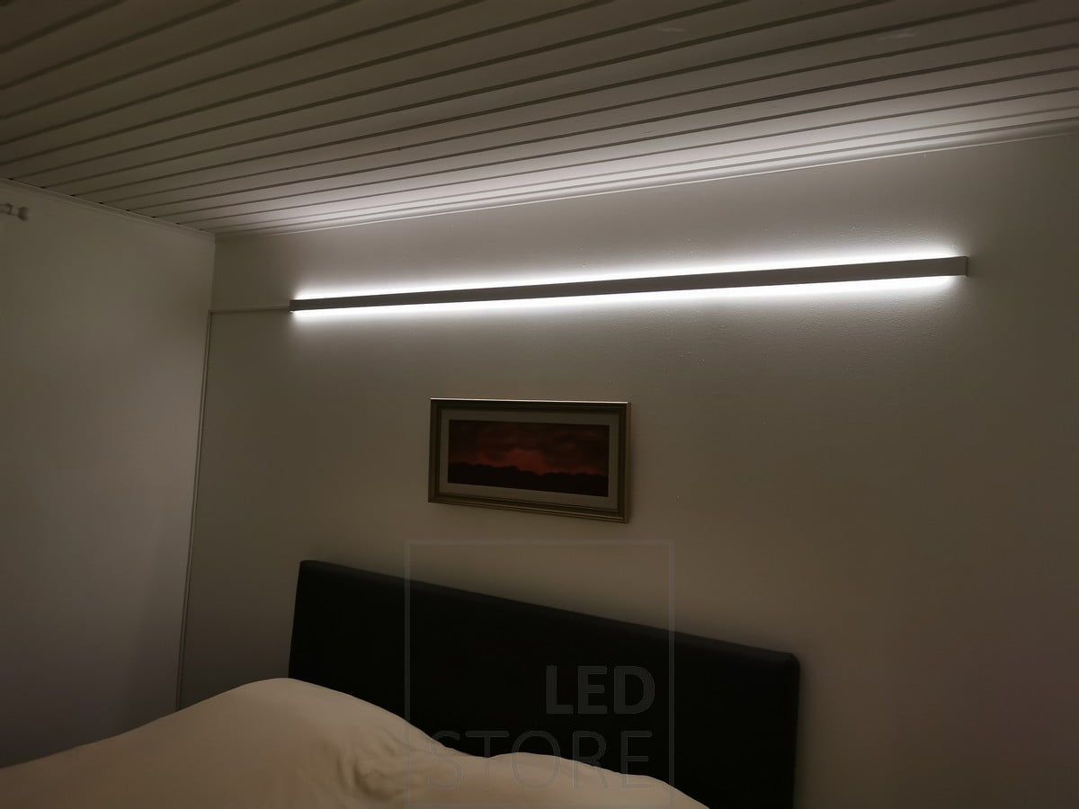 A two-way illuminated aluminium profile as mood lighting in a bedroom. Ledstore.fi