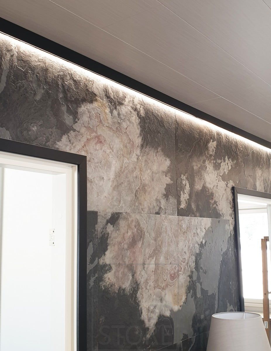 A stylish black wall profile replaces the ceiling moulding. The profile has an LED strip illuminating the space with indirect light. Ledstore.fi