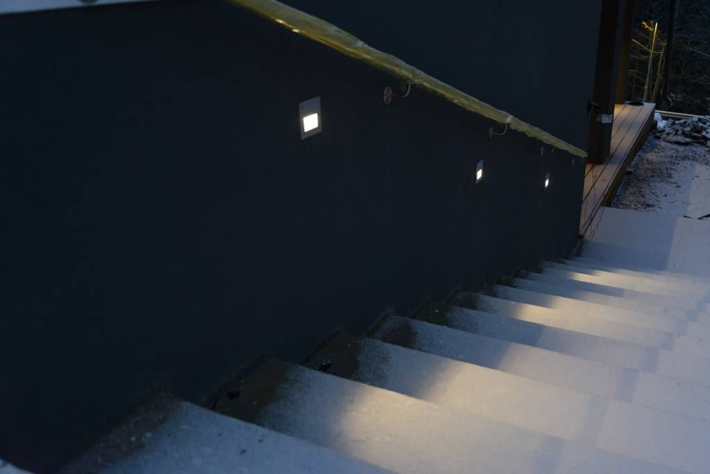 In-wall wall light recessed into the plinth to illuminate the exterior staircase. LedStore.fi
