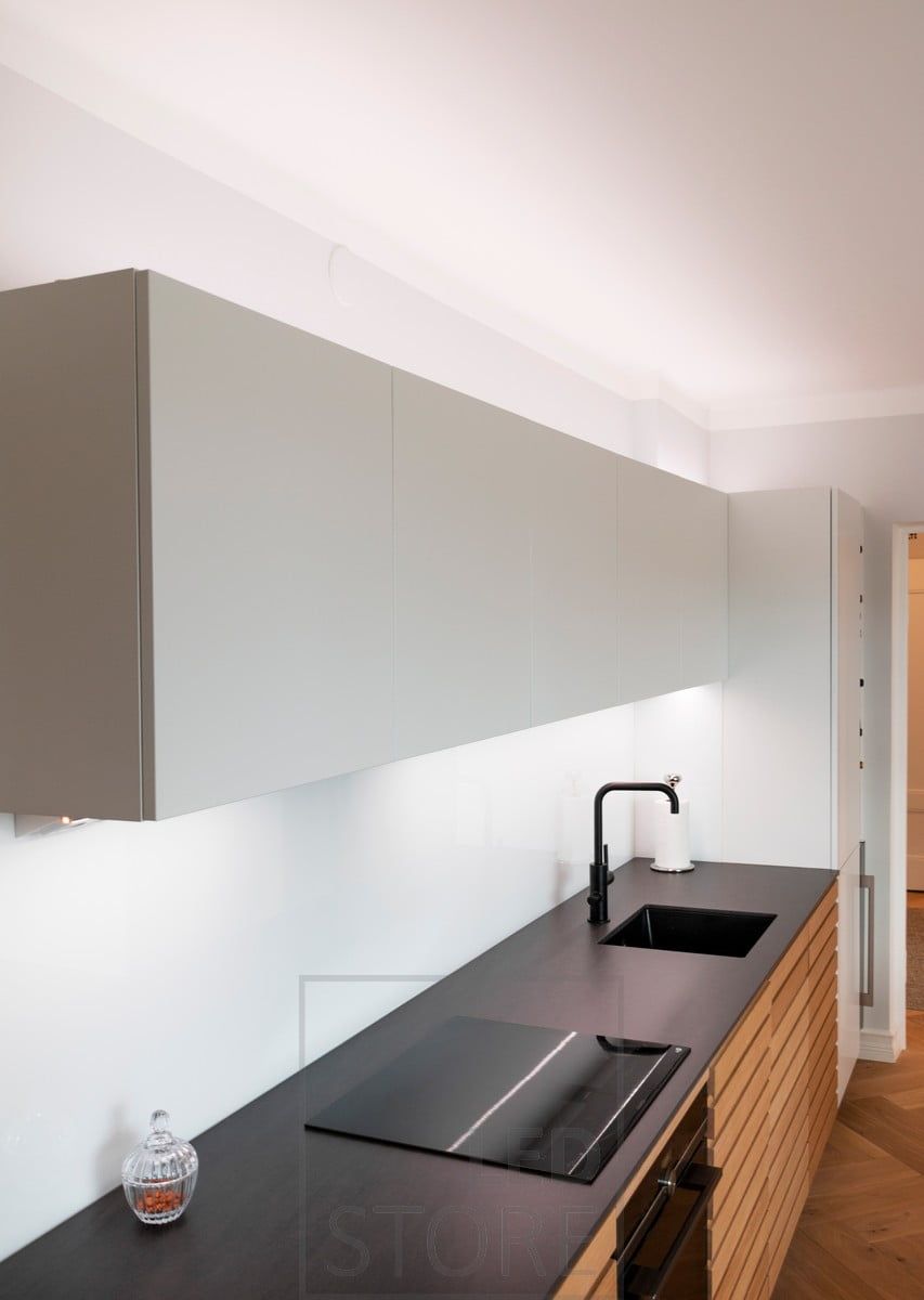 Colour temperature adjustable kitchen lighting, on the worktop and above the cabinets for mood and task lighting. Ledstore.fi