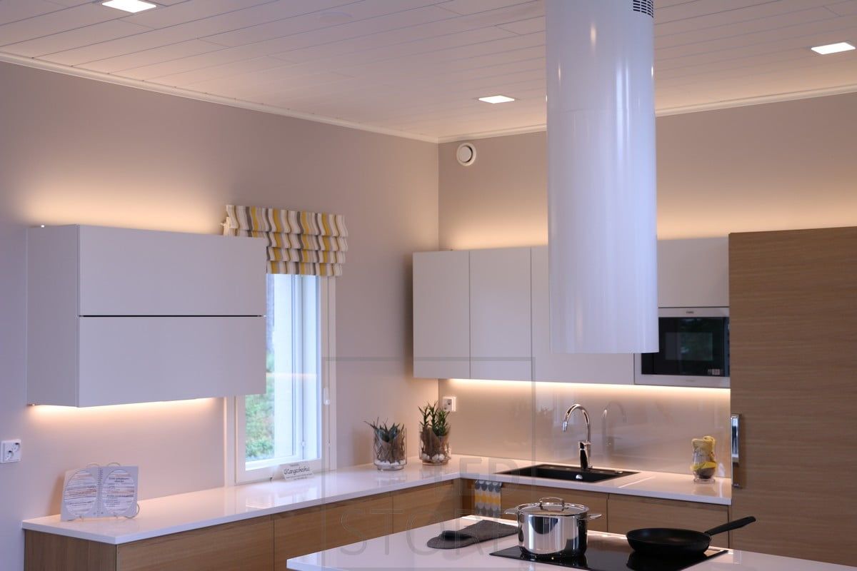 Indirect light on top of cabinets, on top of worktop led strips in low profile. Ledstore.fi