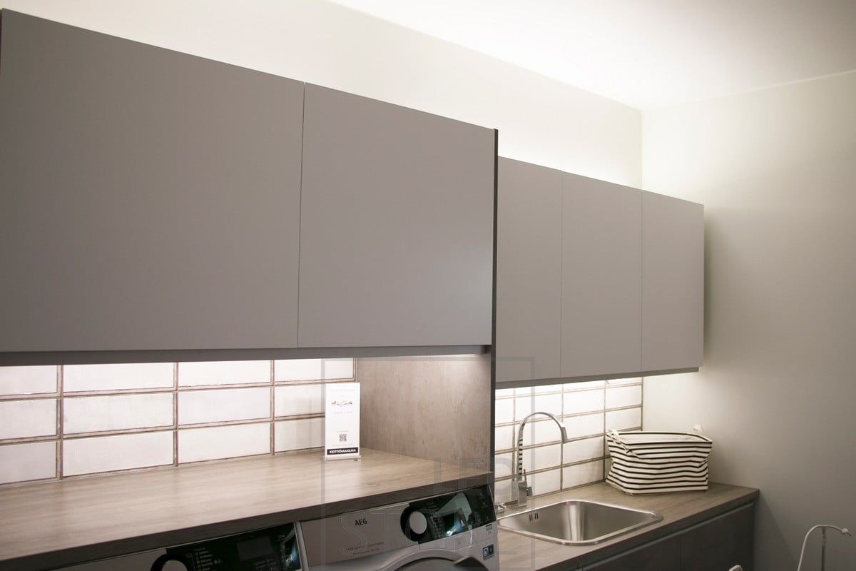 Indirect mood lighting on top of the cabinets, LED strip attached to the bottom of the cabinets as a working light. Ledstore.fi