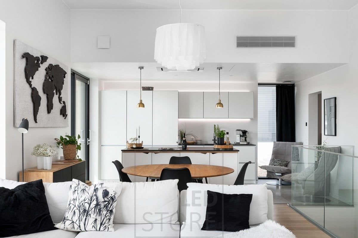 Led strips creating task lighting on the kitchen worktop and mood lighting on the cabinets. Ledstore.fi