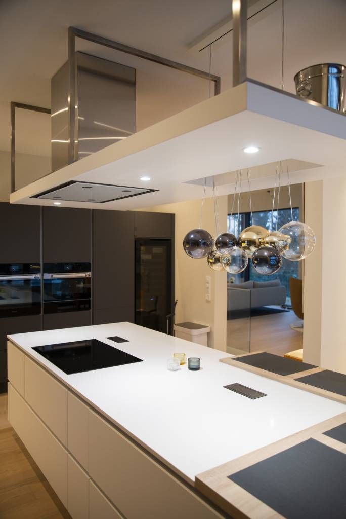 Direct light from white spotlights model 023 in the kitchen island. LedStore.fi