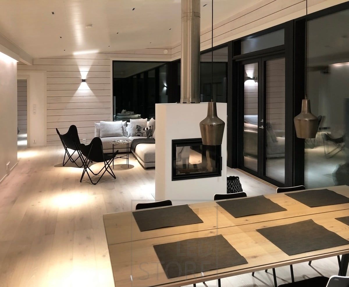 Atmospheric lighting achieved with narrow-angle spotlights, wall lights and indirect light. Ledstore.fi