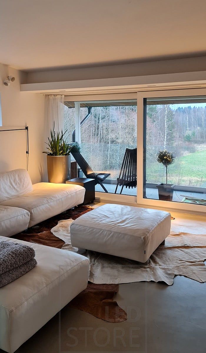 Cosy, warm lighting realized in the living room with LINJA 5 recessed spotlights. Ledstore.fi