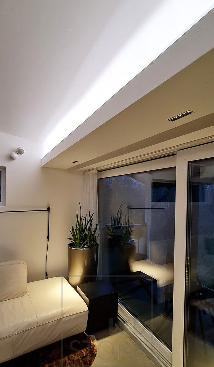 Living room mood lighting with LED strip for indirect light and LINJA 5 spots for narrow-angle light downwards. Ledstore.fi