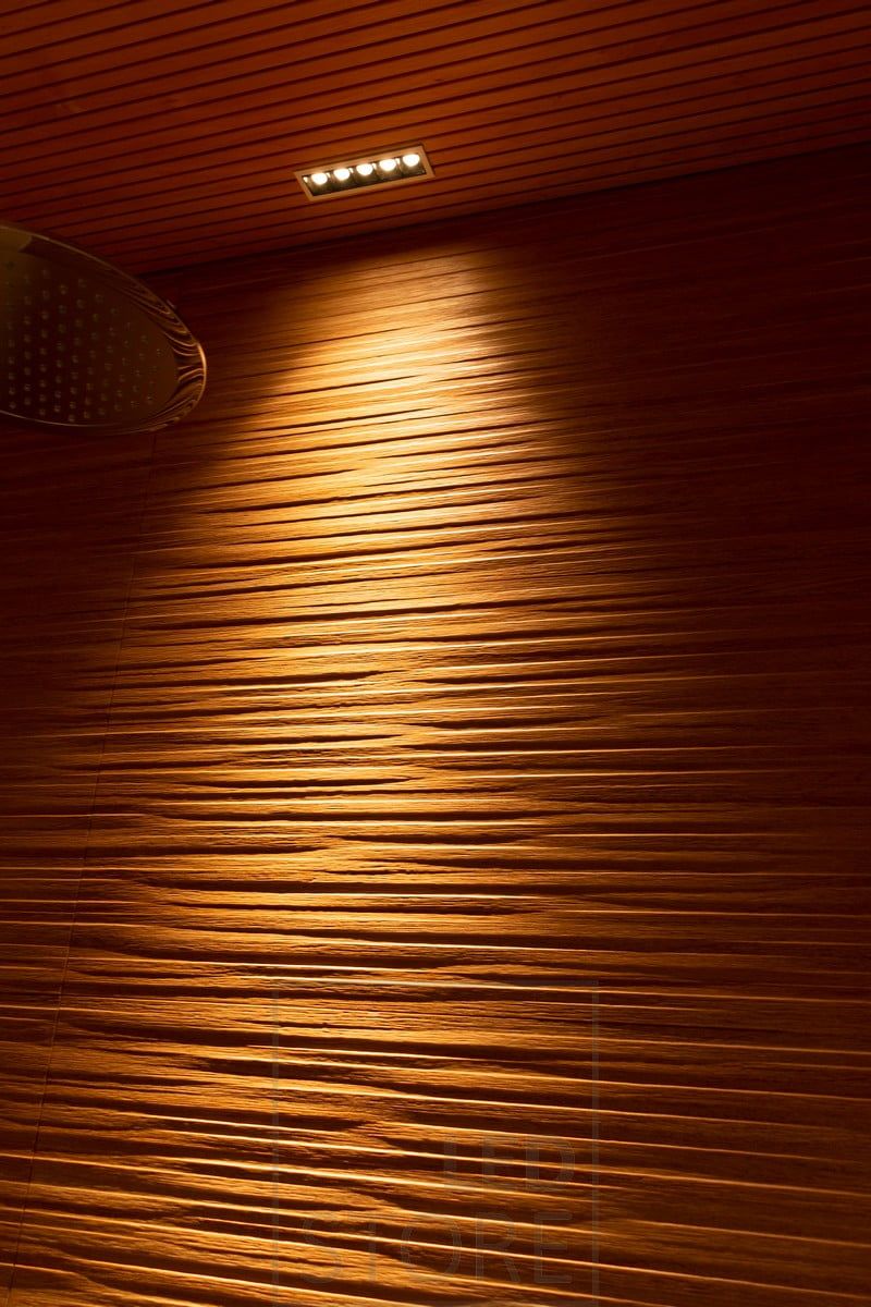 Led LINJA 5 highlighting the beautiful patterned tile of the shower. The texture is beautifully highlighted by the lighting. Ledstore.fi