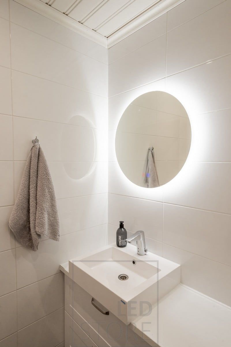Atmospheric light in the bathroom with a light mirror. The colour and gloss level of the wall behind the mirror have a significant impact on the light output. The mirror is 600 mm in diameter, making it ideal for smaller spaces. Ledstore.fi