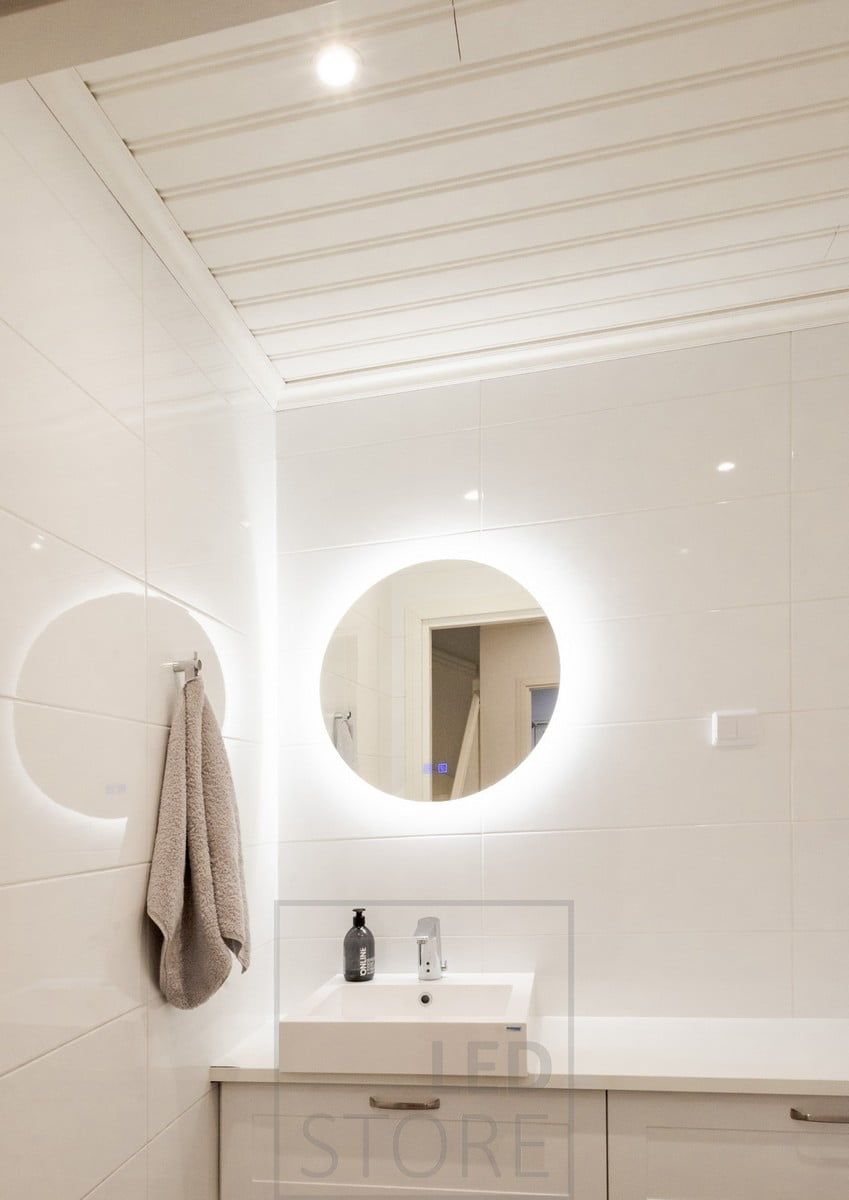 The MOON light mirror is flanked by a 3 cm wide milk glass border, allowing part of the light to shine forward. Spotlights on the ceiling for general lighting. Ledstore.fi