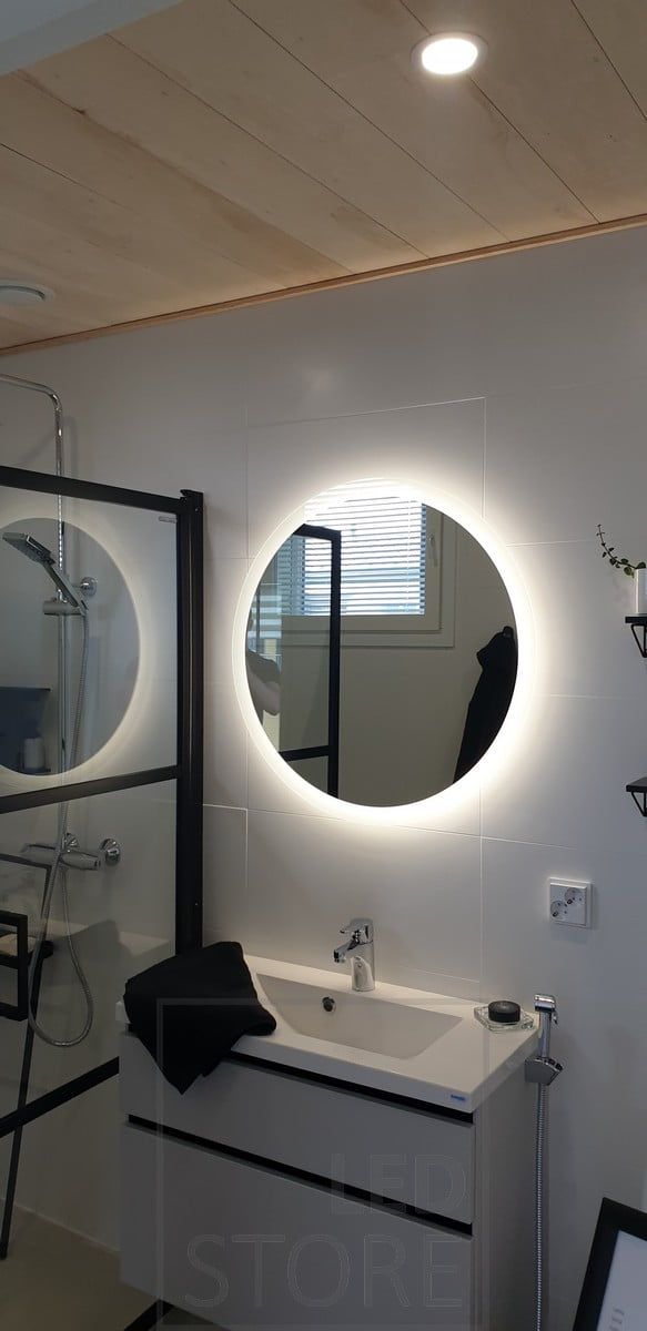 Bathroom illuminated with spotlight and led light mirror. Ledstore.fi