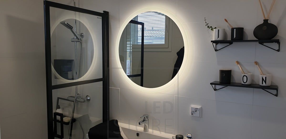 The MOON light mirror is flanked by a 3 cm wide milk glass border, allowing part of the light to shine forward. Ledstore.fi