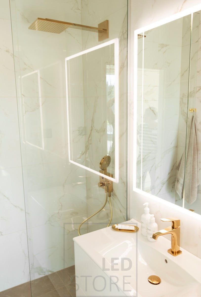 HALO light mirror brings atmospheric, indirect light through the wall into a beautiful and luxurious bathroom. Ledstore.fi