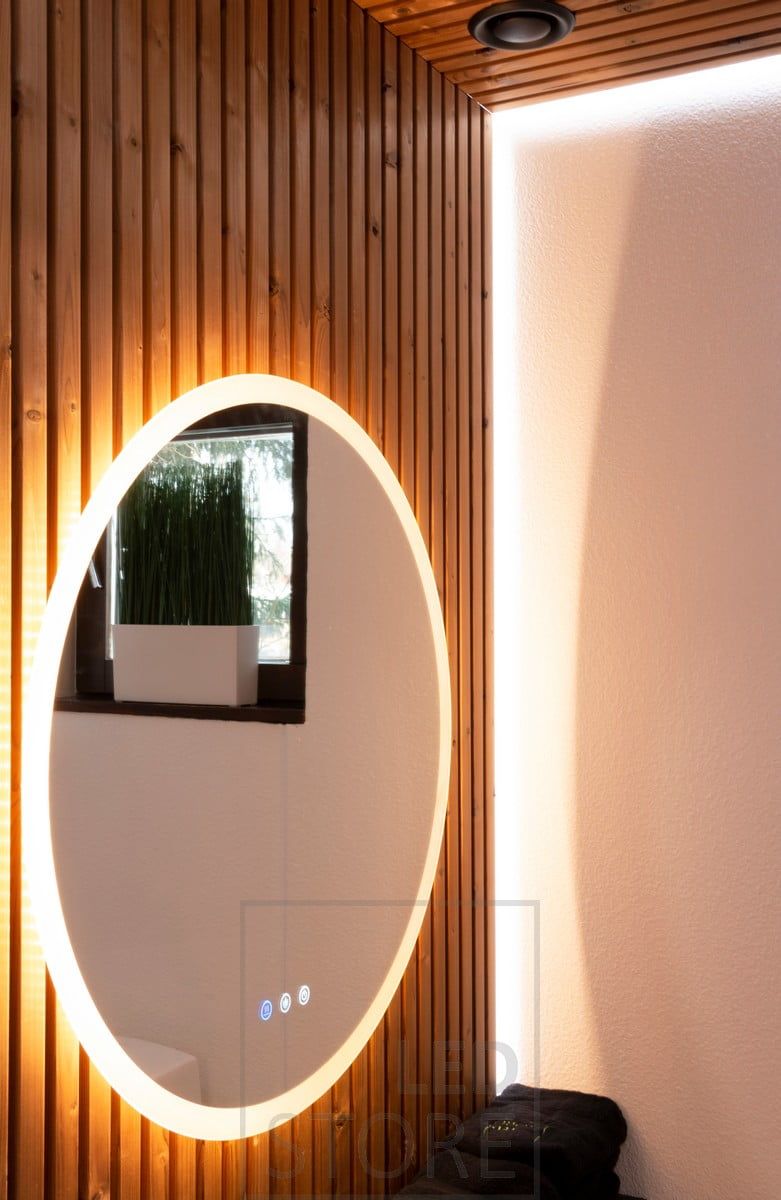 The large light mirror MOON and the LED strip behind the panel create soft lighting in the bathroom. Both the mirror and the LED strip are colour temperature adjustable. Ledstore.fi