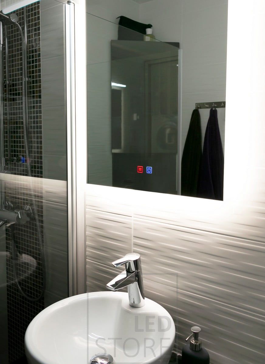 The HALO led light mirror elegantly illuminates the bathroom and highlights the patterned tiles behind the mirror. Ledstore.fi