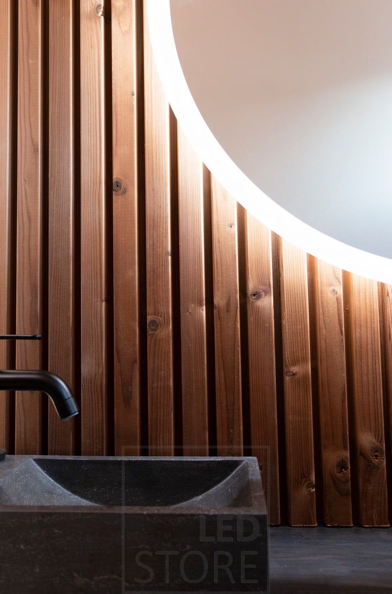 MOON - a circular light mirror illuminates the wall with atmospheric, indirect light. Ledstore.fi