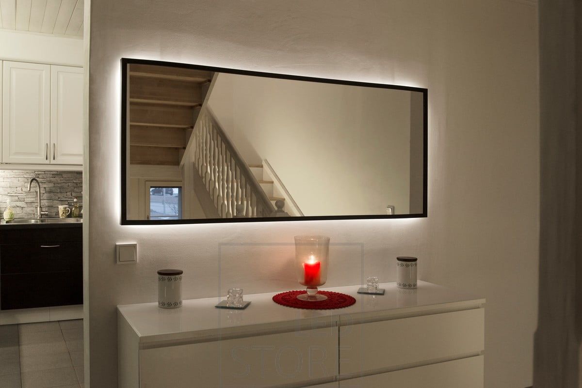 Mirror highlighted with led ribbon. LED strip mounted behind the mirror in the frame, illuminating the wall with indirect light. Ledstore.fi