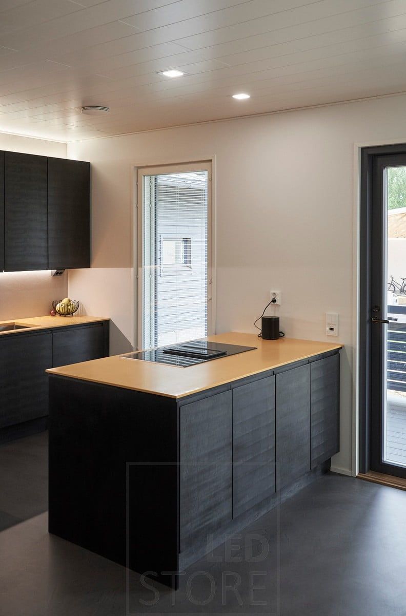 Small led panels illuminating the islet. Led strips illuminate the kitchen with indirect mood lighting. Ledstore.fi
