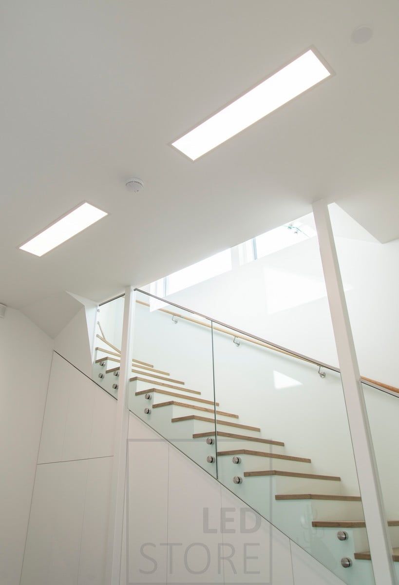 Led panel lights UPPOAVA 300x1200 in a row illuminating a corridor. Ledstore.fi
