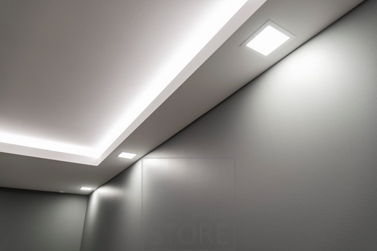 A drop at the edges is an excellent solution for spaces where it is not desired to drop the entire ceiling. Embedded LED panel lights and a LED strip on top of the strip illuminating the ceiling. Ledstore.fi