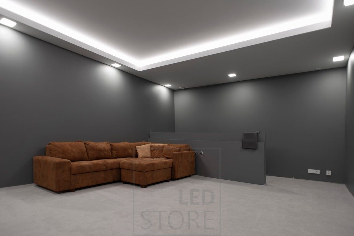 An atmospheric lighting created for a windowless room with panel lamps and LED strip. The panel lamps create general lighting and the LED strip provides indirect mood lighting through the ceiling. Ledstore.fi
