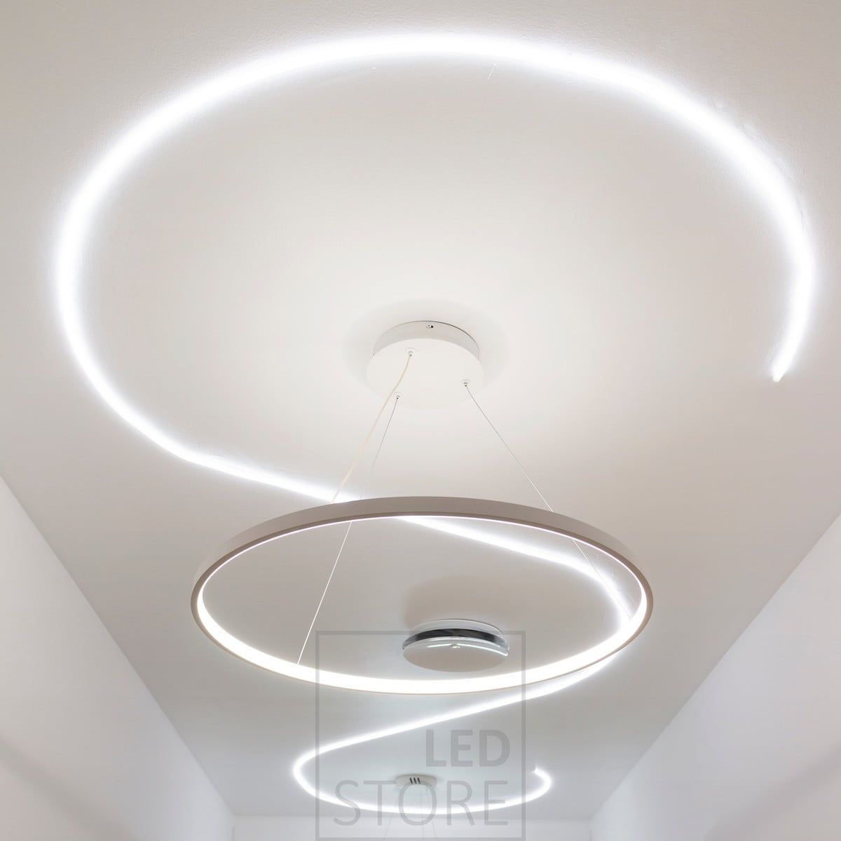 Minimalist and graceful RINKELI pendant luminaire combined with NEON led strip recessed in the ceiling. Ledstore.fi