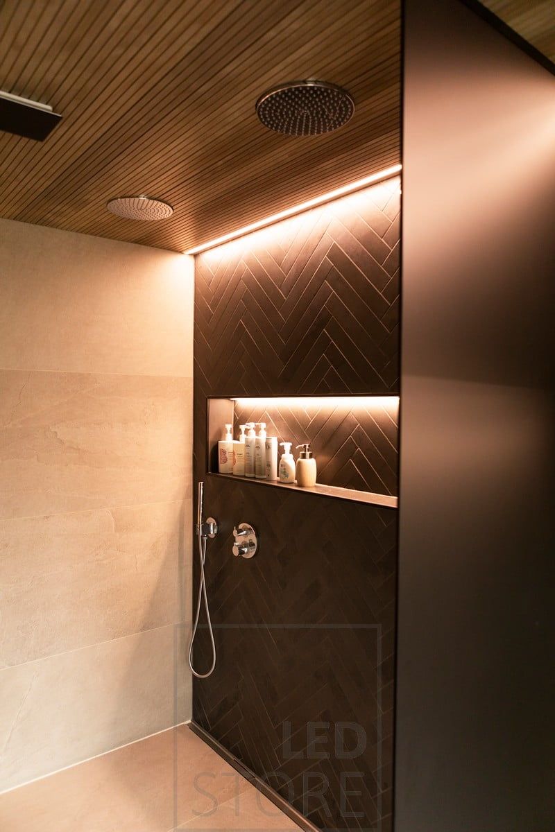 On the shampoo shelf and next to the wall, a led strip creates an indirect accent light. Led ribbon on the flush-mounted profile. Ledstore.fi