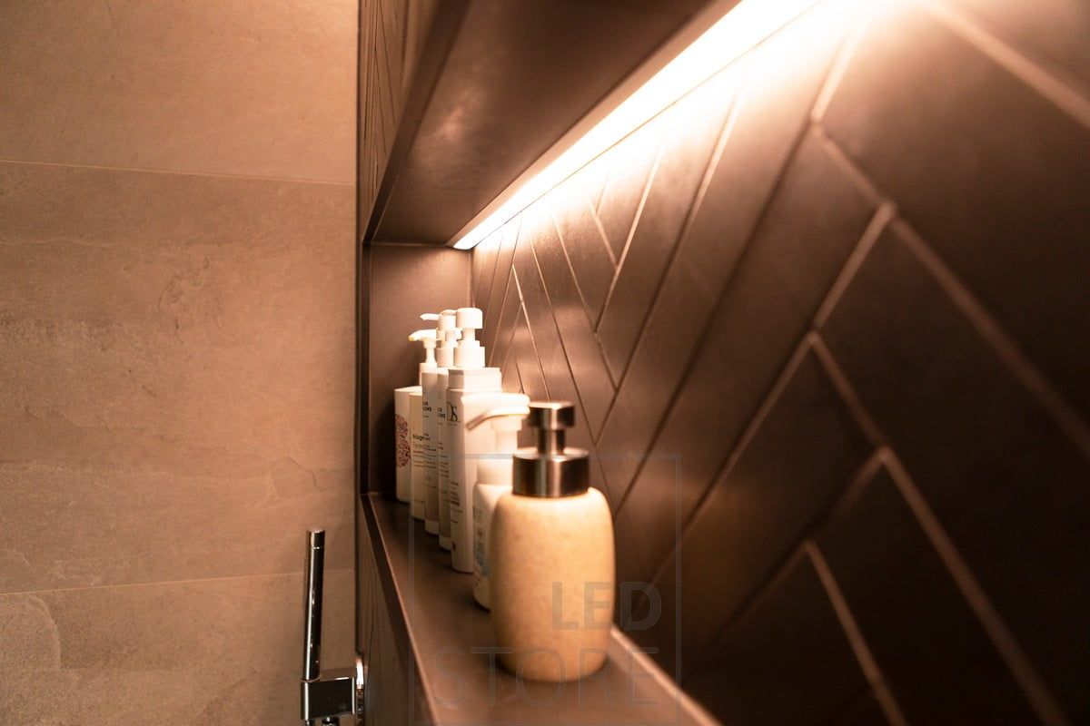 Shampoo shelf with led strip creating indirect highlighting light. Led ribbon in the flush-mounted profile. Ledstore.fi