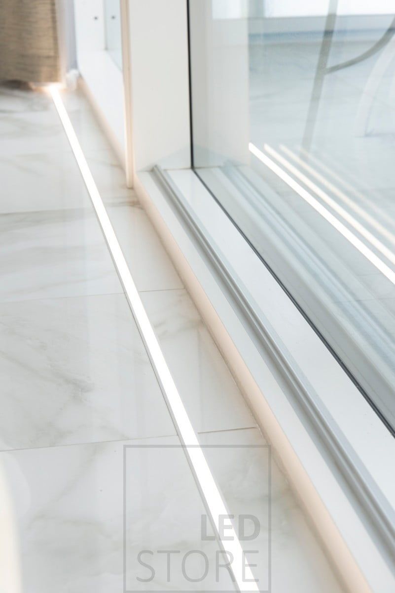 In front of the windows on the floor in the uppoprofile led strip. The lighting highlights the large windows and the beautiful marble floor. Ledstore.fi