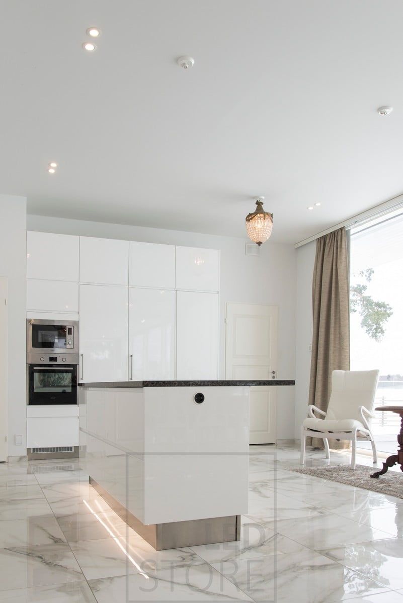 Kitchen island accent realized with led strip on the plinth. Ledstore.fi