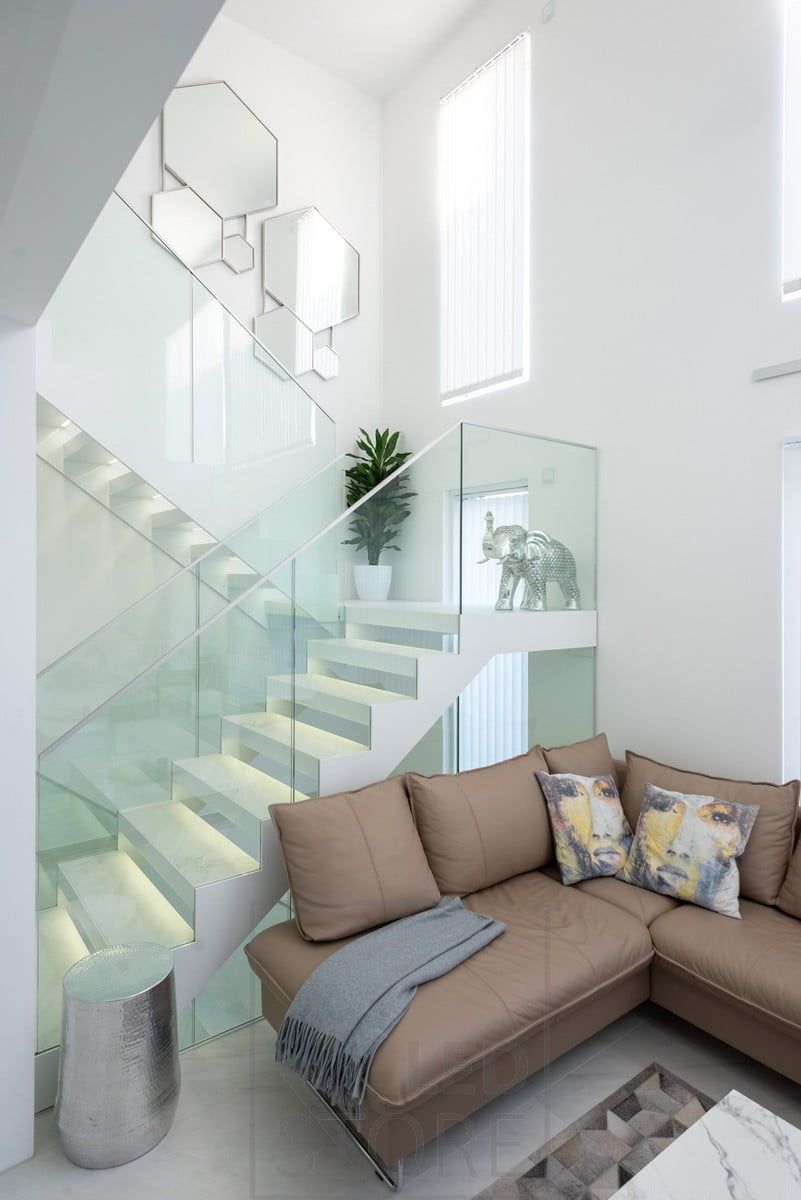 A beautiful and spectacular staircase accentuated and illuminated by LED strips on the steps. Ledstore.fi