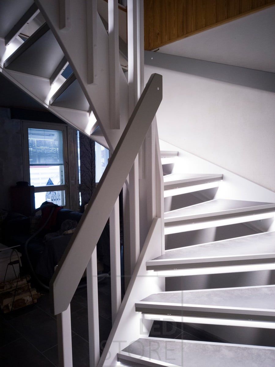 Led strips on the steps illuminating the staircase with indirect light. The lighting is soft and atmospheric. Ledstore.fi