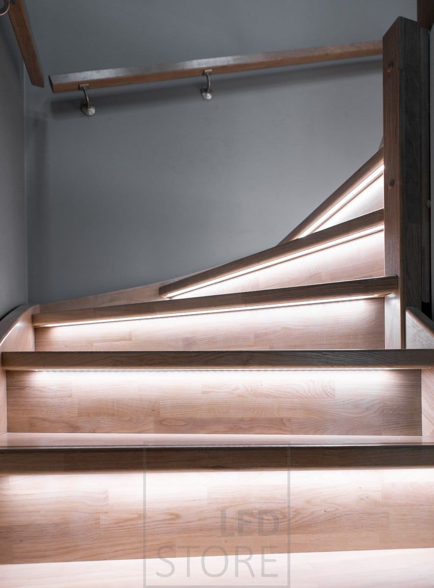 Indirect lighting on steps illuminating a staircase. Led strips on the step lip in the flush-mounted profile. Ledstore.fi